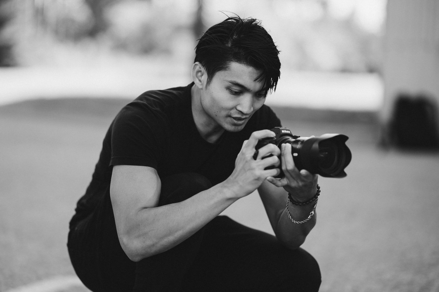 Phil reviewing an image on his camera while photographing an event